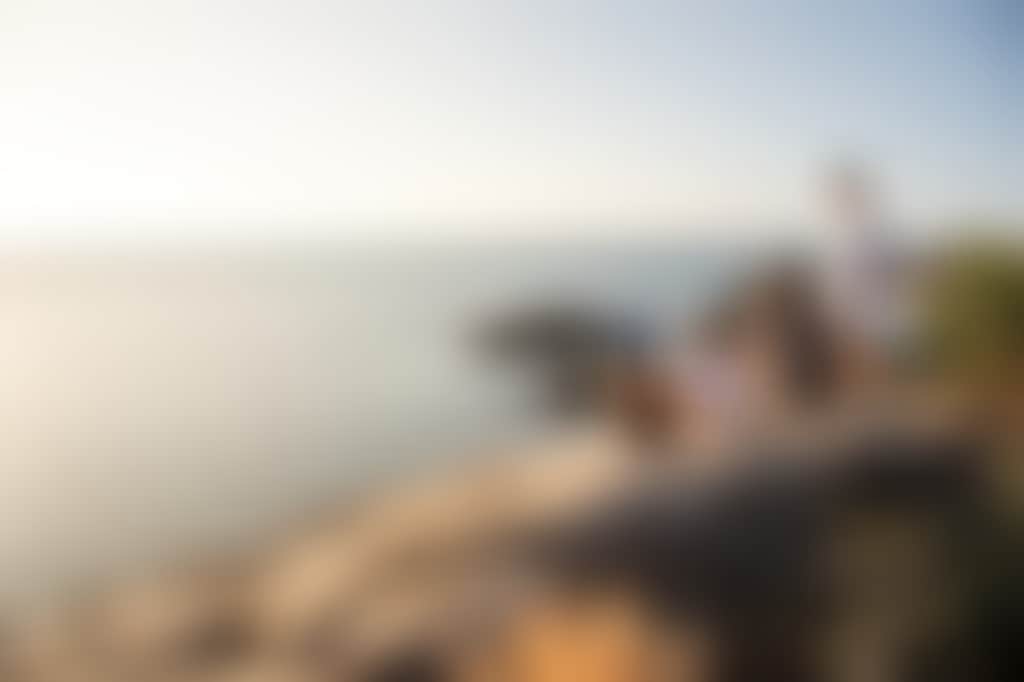 Group of people enjoying a view from top of hill